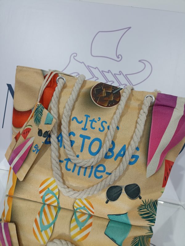 Γυναικεία υφασμάτινη τσάντα θαλάσσης BAG TO BAG σε μπεζ με μωβ αποχρώσεις.
